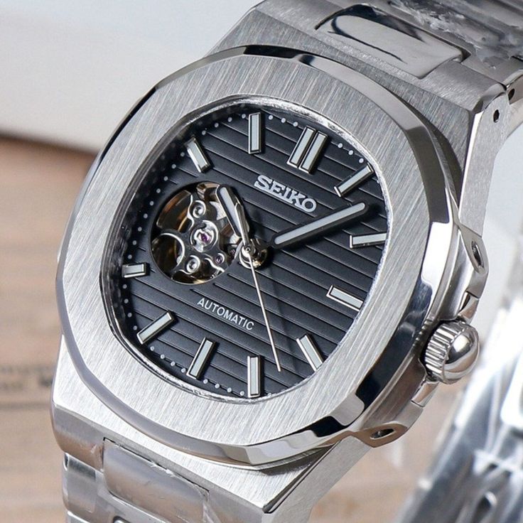 Seiko Steel “Nautilus” Black Dial Open Heart 40